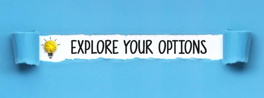 Paper torn to reveal message 'Explore Your Options'