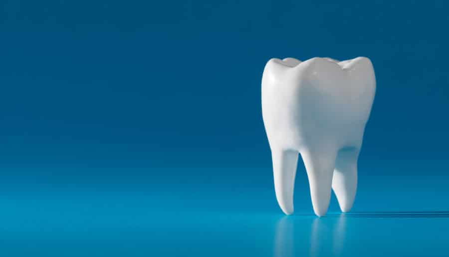 Dentistry Conceptual image | Tooth on Blue Background